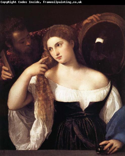 TIZIANO Vecellio Portrait d'une femme a sa toilette